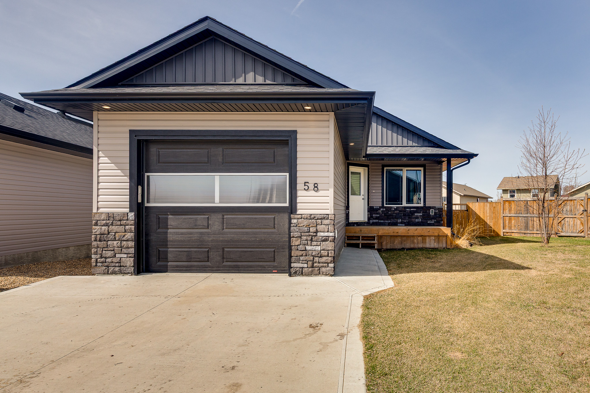 Front exterior of 58 Ranchers Close in Lacombe
